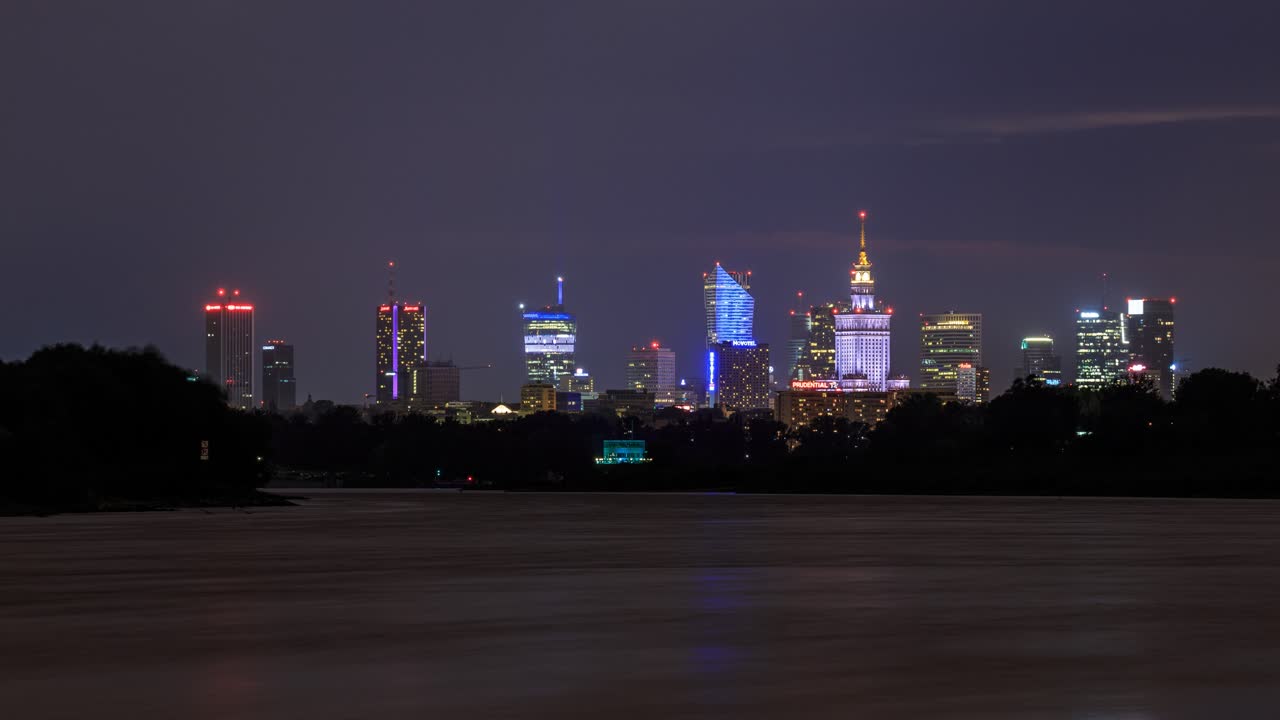 Thunder storm over Warsaw, Poland with reflections of the skyscrapers and lighting in the Vistula river. Video with camera motion.