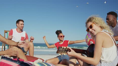 young adult friends hanging out together at the beach 4k