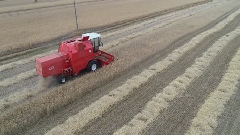 close up aerial of harvester red tractor machine