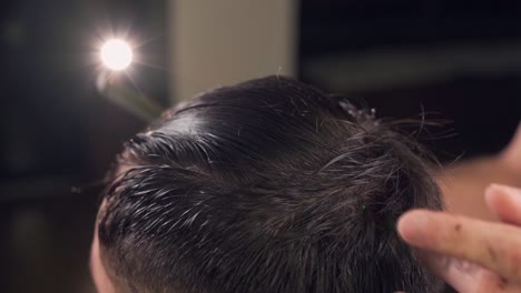 closeup-male-hands-shearing-with-barber-shop-scissors