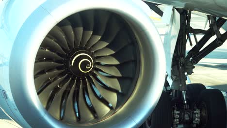 airplane jet engine spinning blades are moving