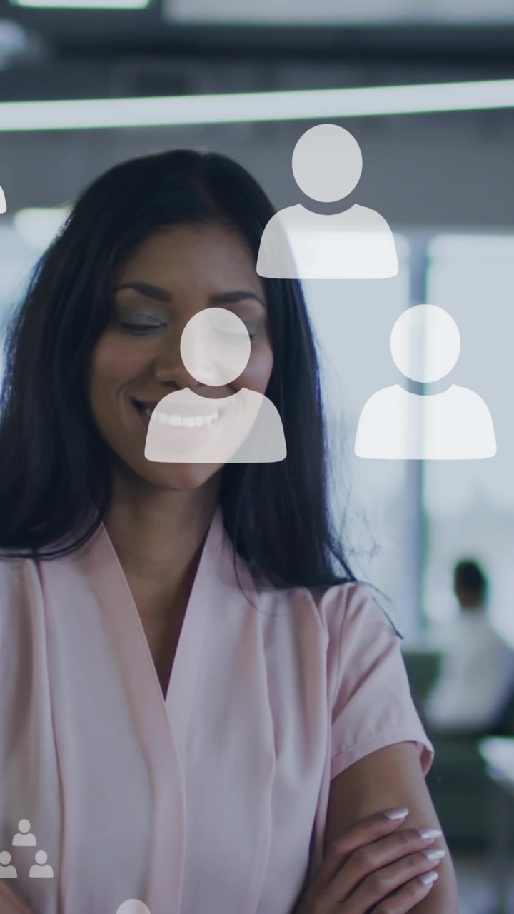 Animation of network of connections with icons over businesswoman in office