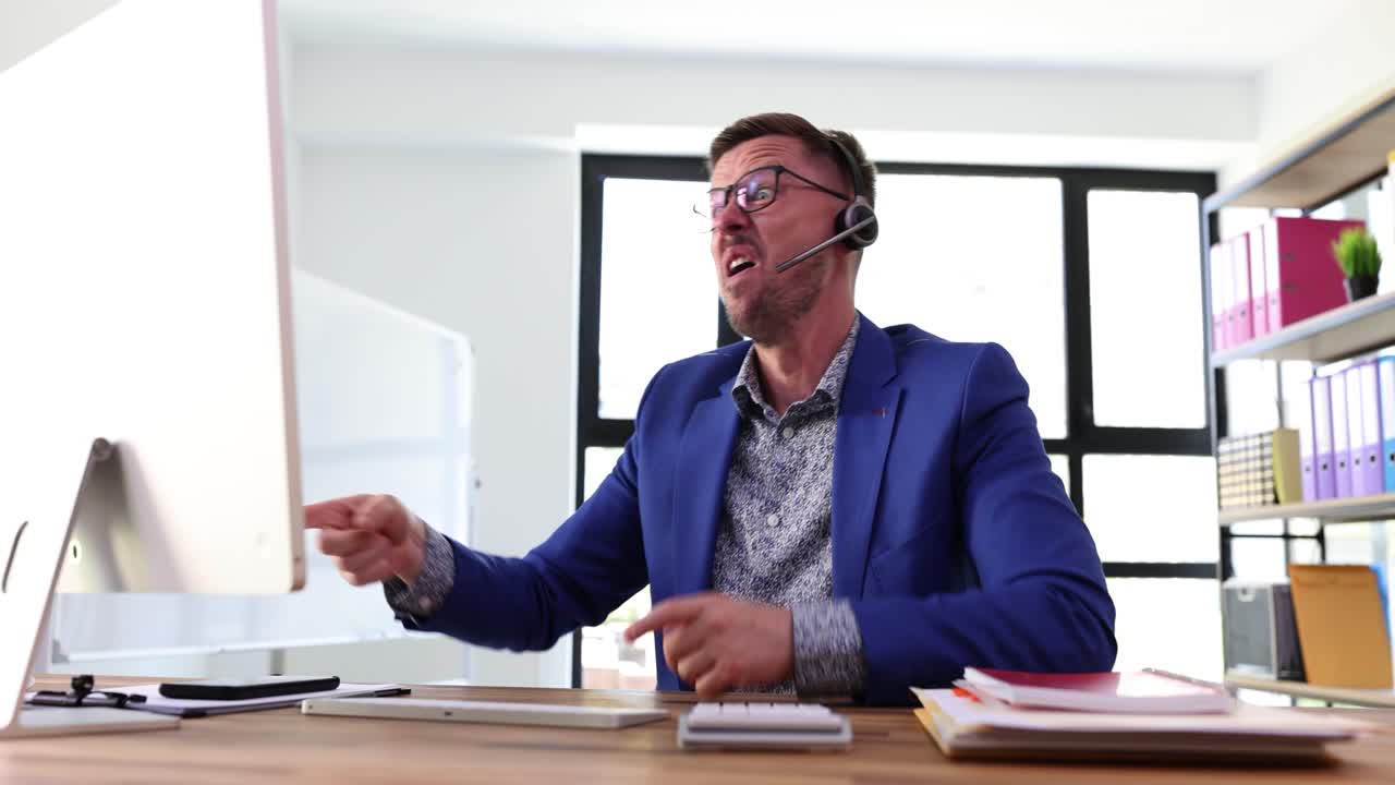 Frustrated Businessman Expressing Anger at Computer