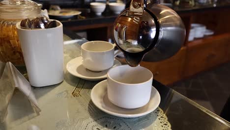 coffee being poured into a cup