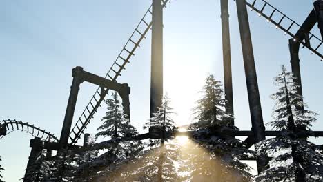 old roller coaster at sunset in forest