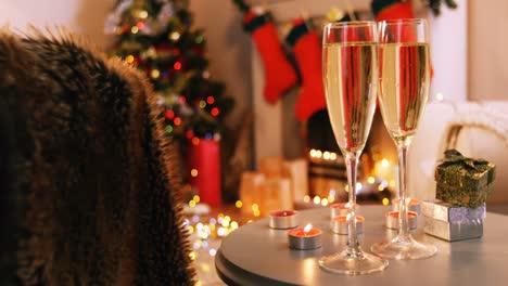 champagne glasses and gifts box on table