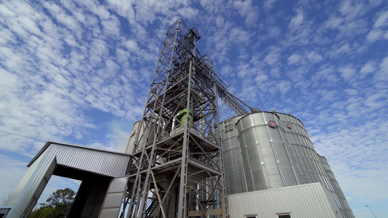 Factory on processing grain crops. Industrial large hangar premises. Modern new equipment at the plant for storage harvest.