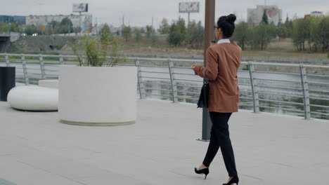 business woman walking outdoors