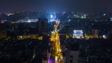 china night time illuminated wuhan cityscape traffic street aerial panorama 4k time lapse