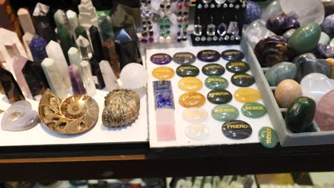 various gemstones, crystals, and jewelry on display