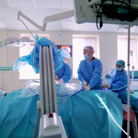 modern equipment in operating room. team surgeon at work in operating room. surgeon in operating room with surgery equipment