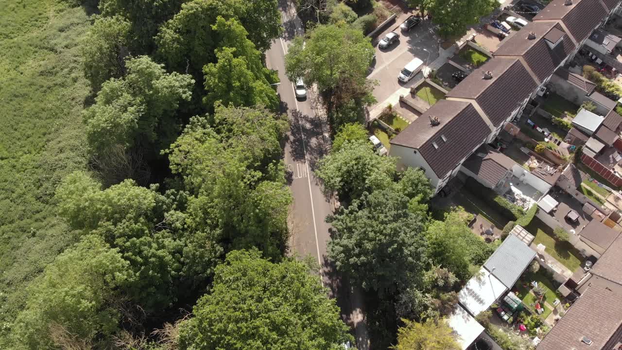 Houses And Cars At An Irish Estate In Clondalkin, Dublin, Ireland On A Sunny Day - aerial view