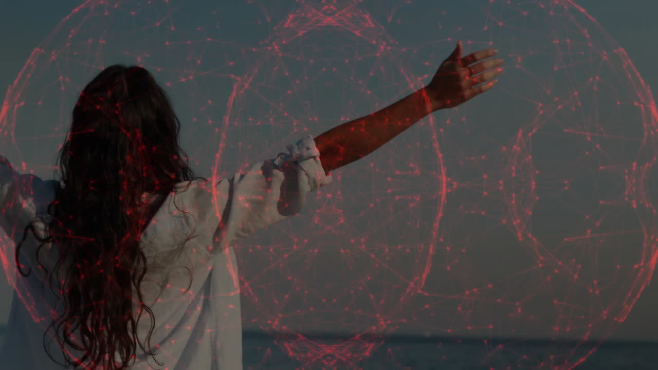 Woman with outstretched arm over digital red sphere animation by sea