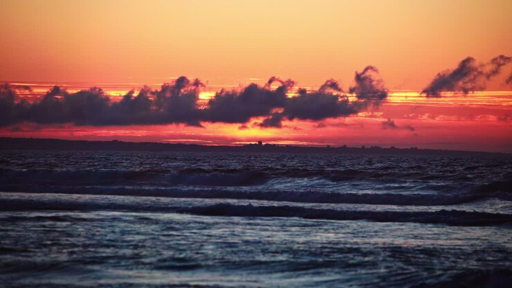 Vibrant Santa Cruz sunset with stunning ocean views, golden skies, and rolling waves—ideal for cinematic scenes, travel videos, or peaceful nature backgrounds.