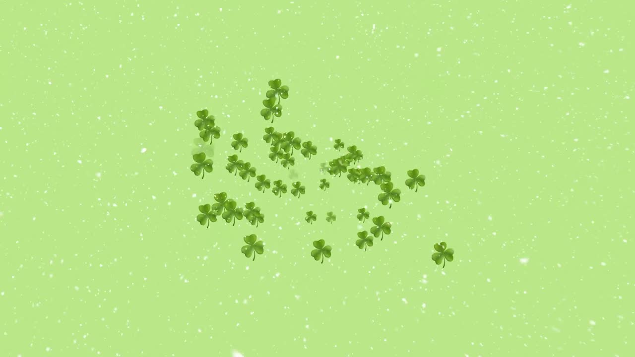 Animazione di foglie di trifoglio e neve che cade su uno sfondo verde