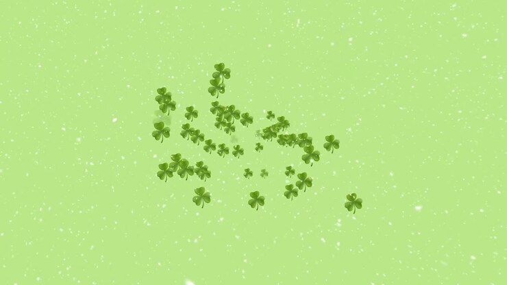 Animazione di foglie di trifoglio e neve che cade su uno sfondo verde