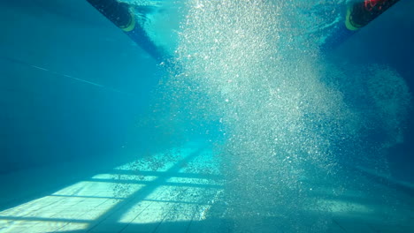 underwater view of man swimming