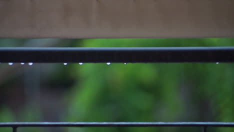 Footage-of-balcony-rail-guard-with-raidrops-falling-CLOSEUP