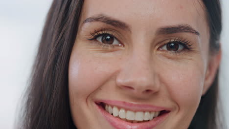 Portrait-happy-girl-smiling-at-bathroom.-Brown-eyed-beauty-woman-looking-camera