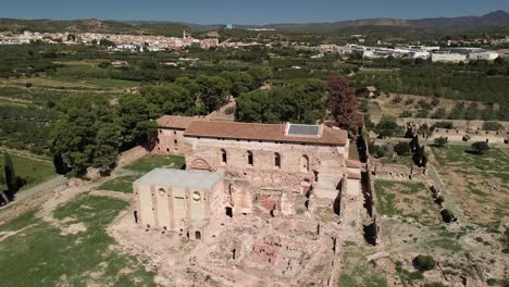 general drone shot of the surroundings of the monastery of the cartuja vall de cristo with the village of altura, castellón, in the background