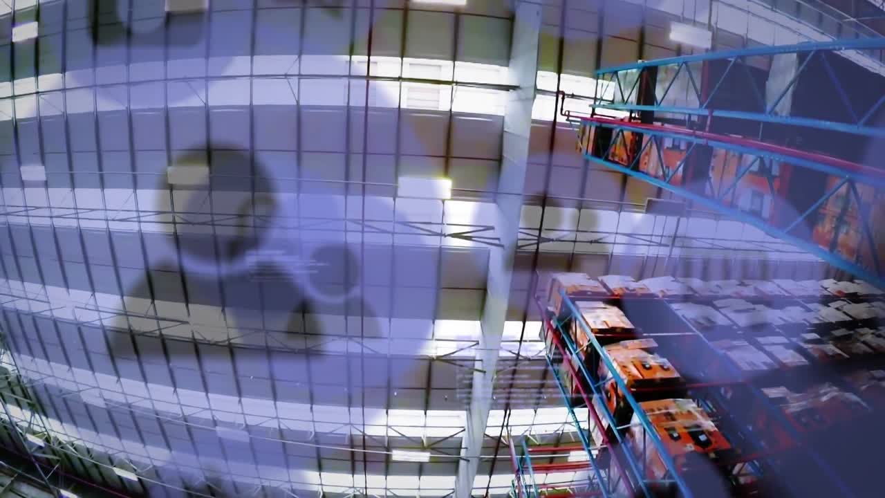 Animation of digital icons and data processing over empty warehouse
