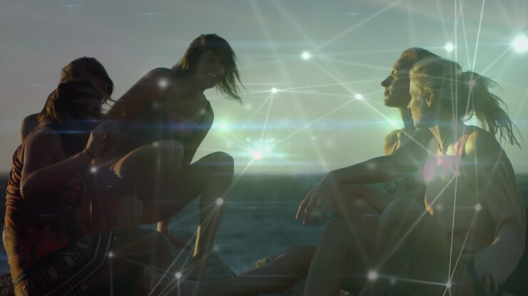Animation of networks of connections over happy group of friends having fun at the beach