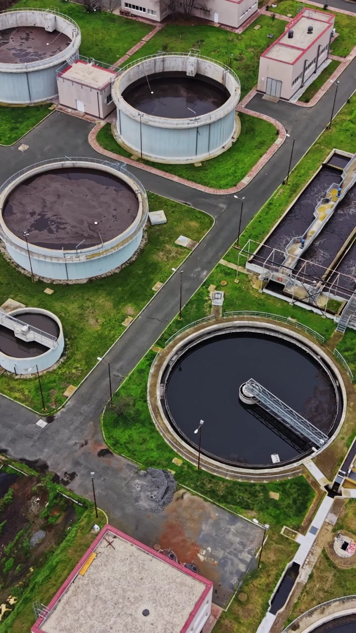 Wastewater treatment plant located in a city environment during daytime