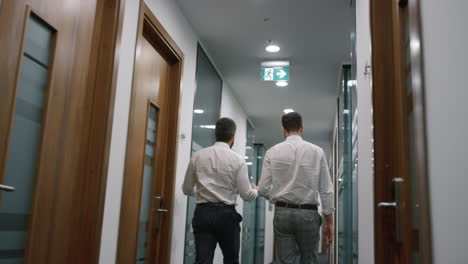 team of businessmen walking in the office