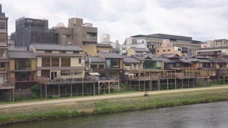sanjo and gion shijo area of kyoto, pan across neighbourhoods along kamogawa