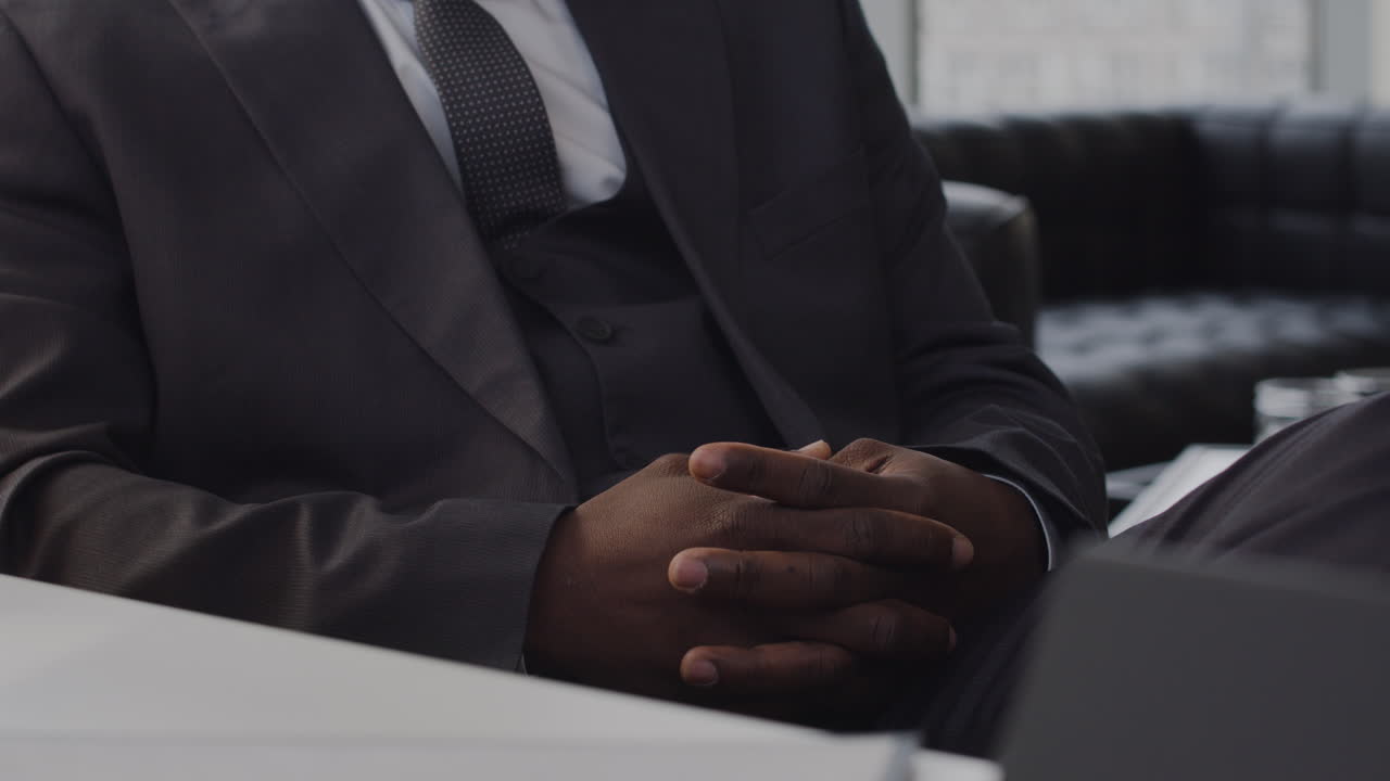 Closeup of man's hands indoors