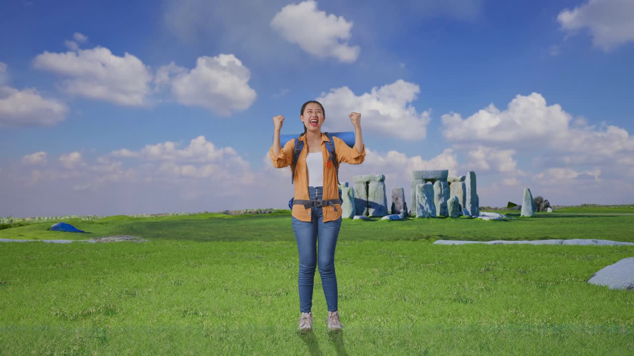 Full Body Of Asian Female Hiker With Mountaineering Backpack Screaming Goal Celebrating The Success While Traveling In Stonehenge
