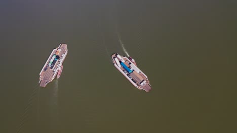 aerial view of a ferry that transports cars and trucks between the border of the states of tocantins and maranhão in northeastern brazil by river