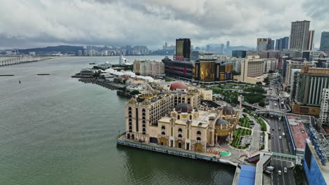 a large body of water with a city in the background