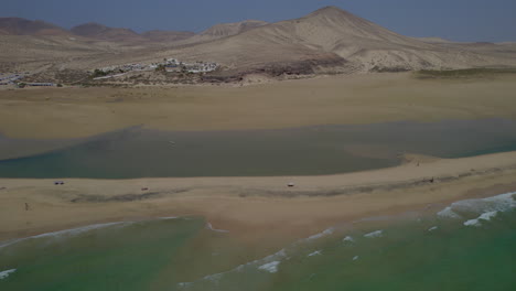 sotavento beach, fuerteventura: wonderful aerial view traveling out to the fantastic beach and beautiful mountain