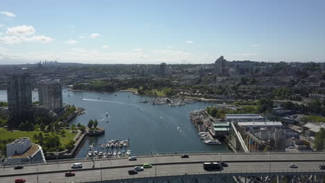 Aerial-rises-over-Granville-Street-bridge,-False-Creek-in-Vancouver