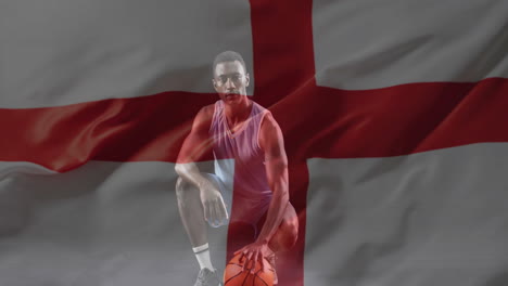 animation of flag of england over african american male basketball player