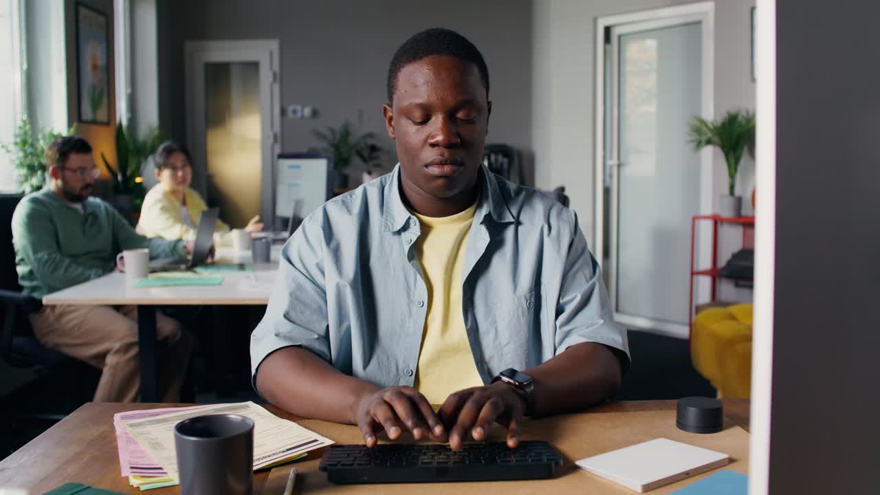 Man Working at a Desk in an Office