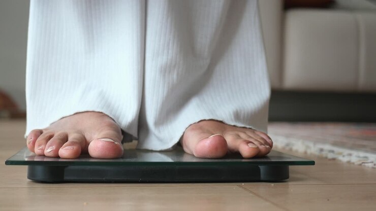 Person standing on a bathroom scale