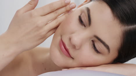 close-up-portrait-beautiful-caucasian-woman-touching-face-with-hand-caressing-smooth-healthy-skin-complexion-enjoying-perfect-natural-skincare-gorgeous-feminine-beauty-concept