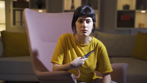 psycho young woman holding the knife to the camera.