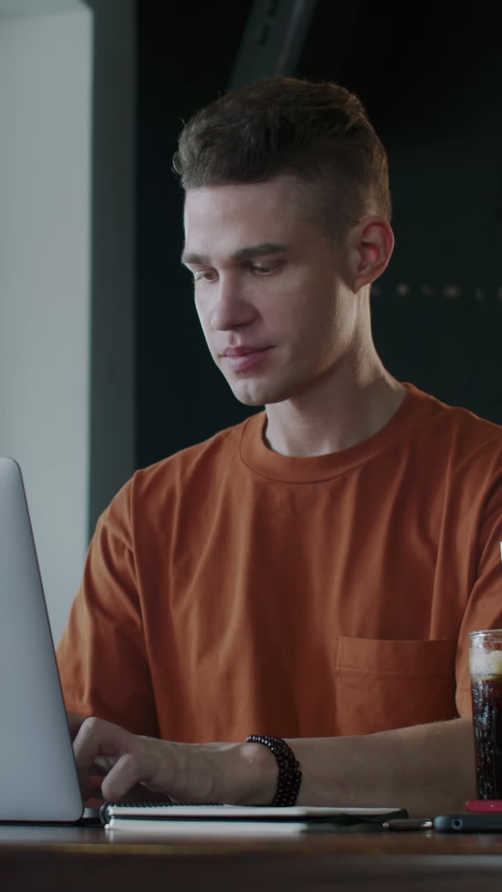 Portrait of Businessman Working in Cafe