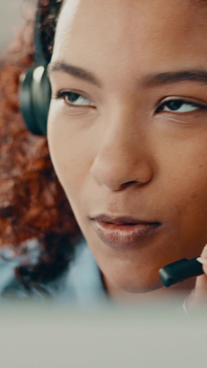 Customer Service Representative Talking on Headset in Office