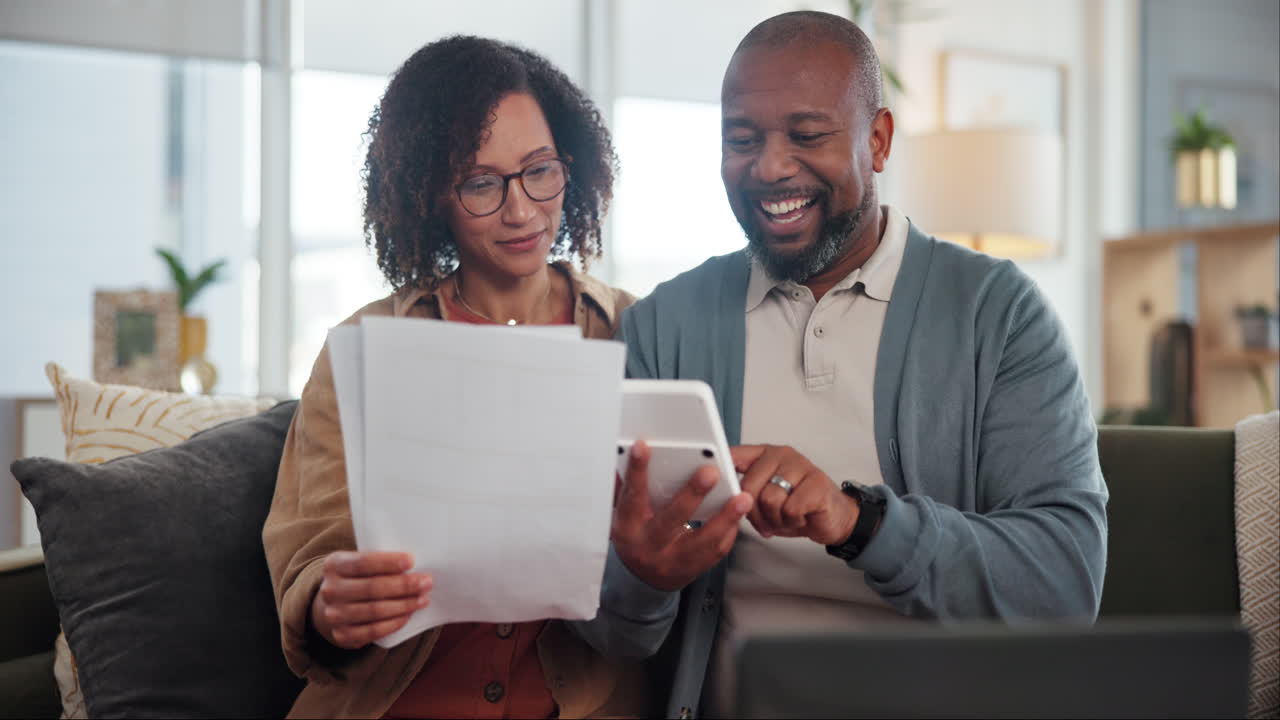 Couple reviewing bills and finances at home