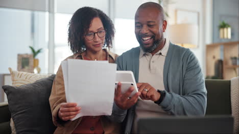 couple reviewing bills and finances at home