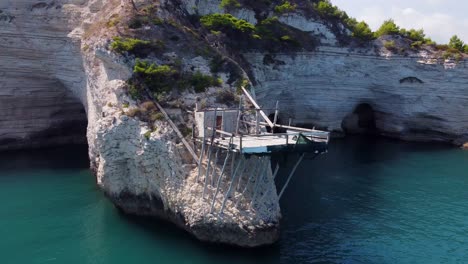 trabucco fisherman house on cliffs surrounded by sea