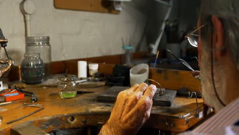 goldsmith manufacturing jewellery in workshop 4k