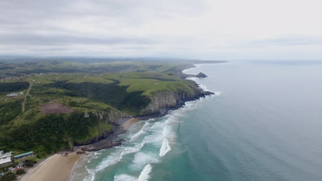 cinematic aerial flying along coast of east london south africa