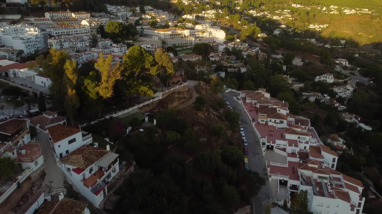 Private villas, narrow streets and Mijas township, aerial view