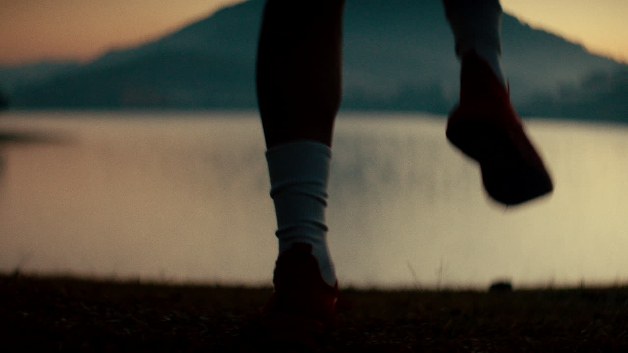 Running by the lake at sunset
