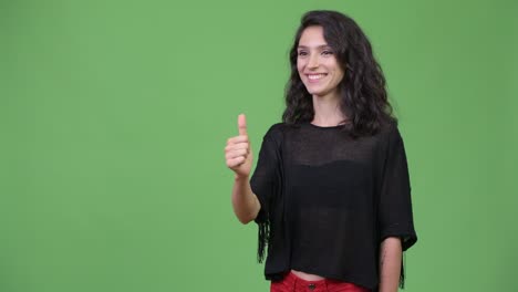 young beautiful woman giving thumbs up